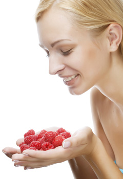 Women Holding Raspberries in Her Hand image