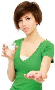 Woman Skeptical About Taking a Pill image